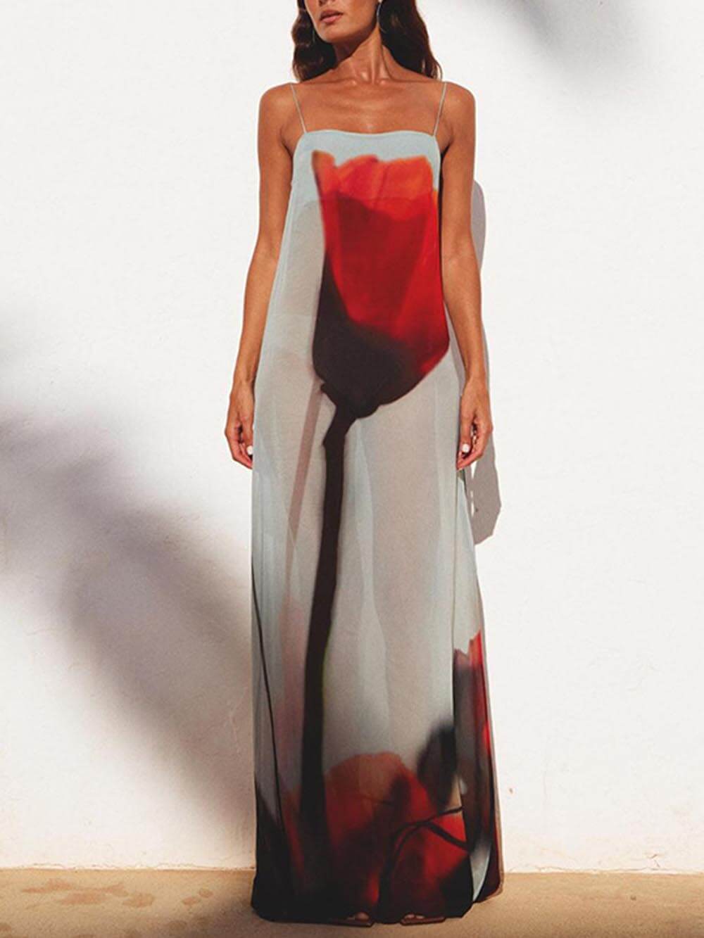 Stylish women's flowy blue abstract print maxi sundress, ideal vacation wear and beach dress for summer.
