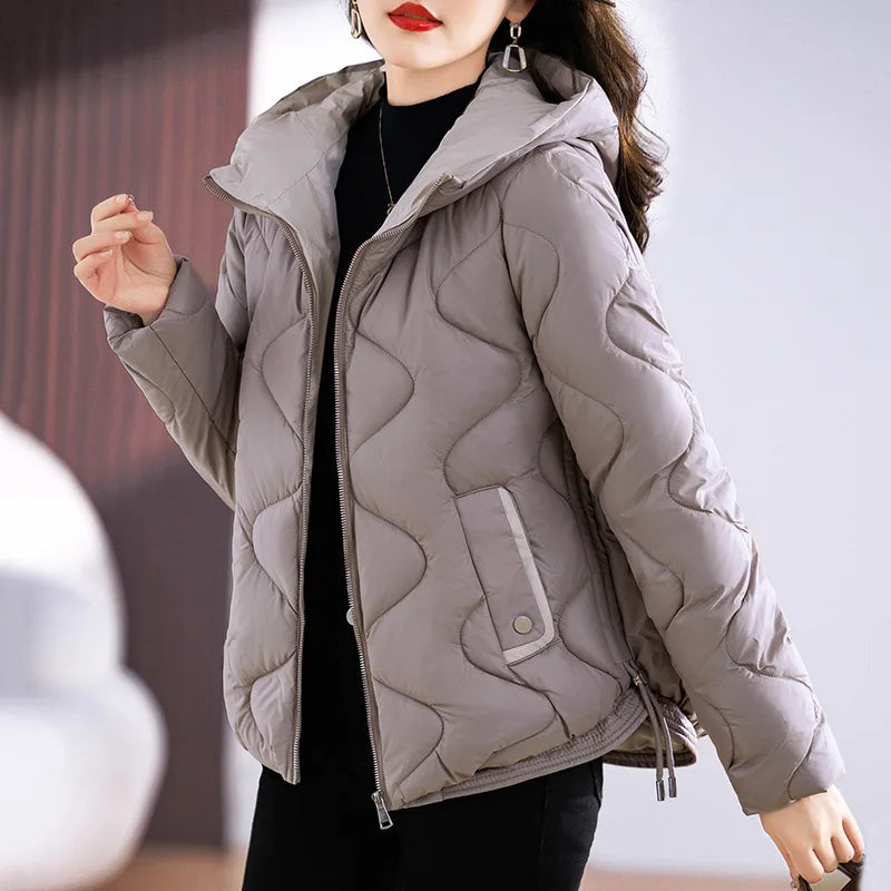 Women's chic quilted puffer jacket. Warm & versatile outerwear for stylish fall and winter fashion.