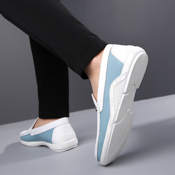 Dapper men's two-tone slip-on loafers, ideal for sophisticated everyday fashion.