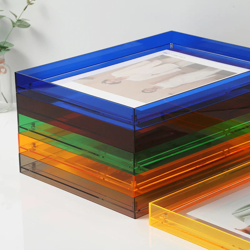Crystal clear acrylic picture frame, showcases photos vividly on wall or tabletop.