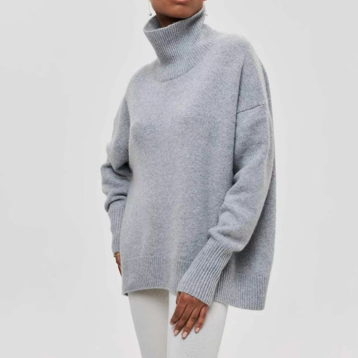 Enjoy the warmth of this women's oversized knit turtleneck sweater. Perfect for cozy fall & winter fashion.