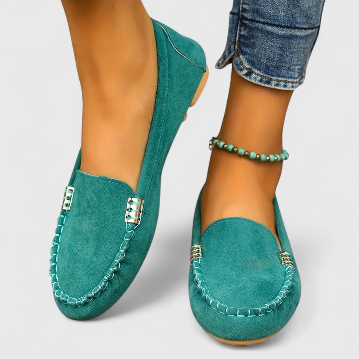 Women's orthopedic slip-on loafers with stylish metal accents, perfect for daily comfort.