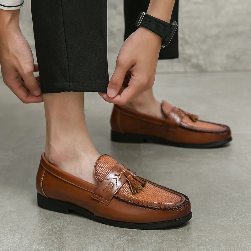 Sophisticated men's woven tassel loafers. Premium slip-on dress shoes offering elegant style and comfort for formal attire.