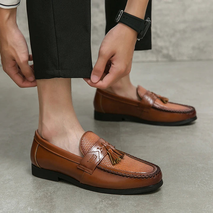 Sophisticated men's woven tassel loafers. Premium slip-on dress shoes offering elegant style and comfort for formal attire.