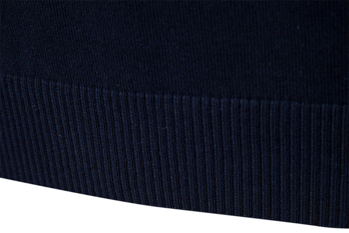 Black-blue colorblock half-zip, men's fashion sweater with stand collar, modern style.