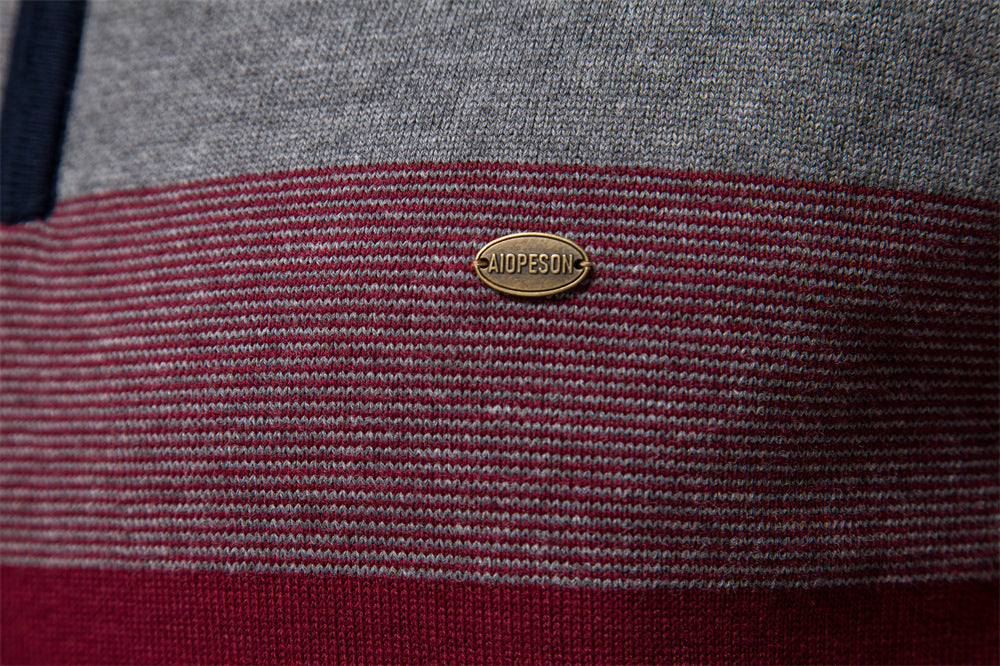 Men's grey colorblock half-zip sweater, essential for modern layering and casual appeal.