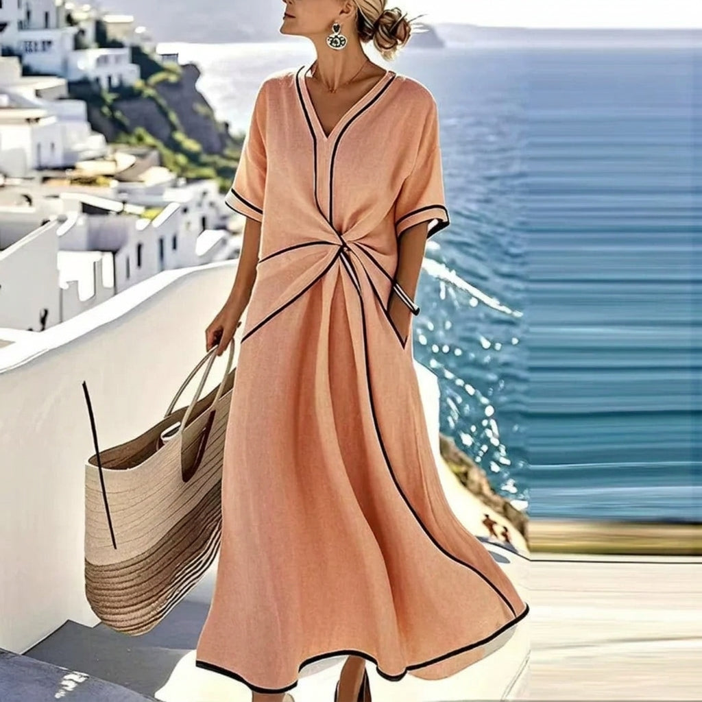 Stylish women's elegant flowing midi dress. Ideal for evening, cocktail, and party occasions. Comfortable fashion.