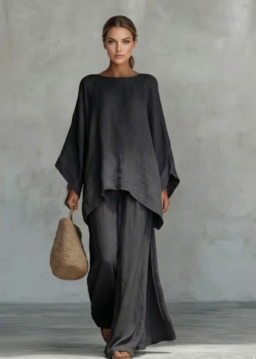 Bohemian chic women's two-piece set featuring a unique cape top & relaxed wide leg pants for spring.