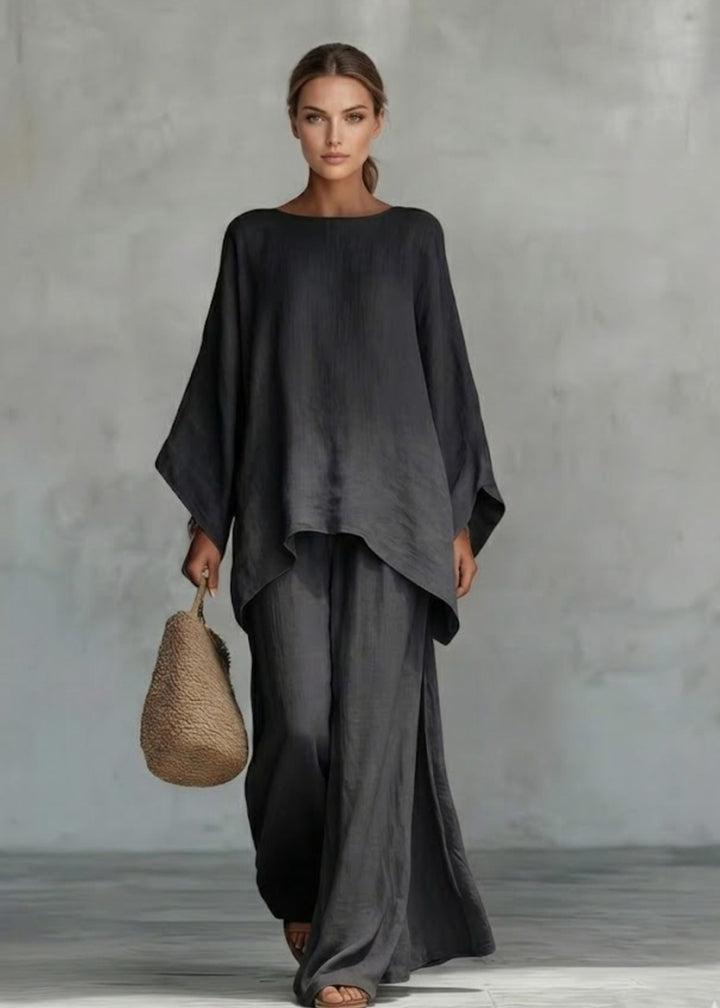 Bohemian chic women's two-piece set featuring a unique cape top & relaxed wide leg pants for spring.