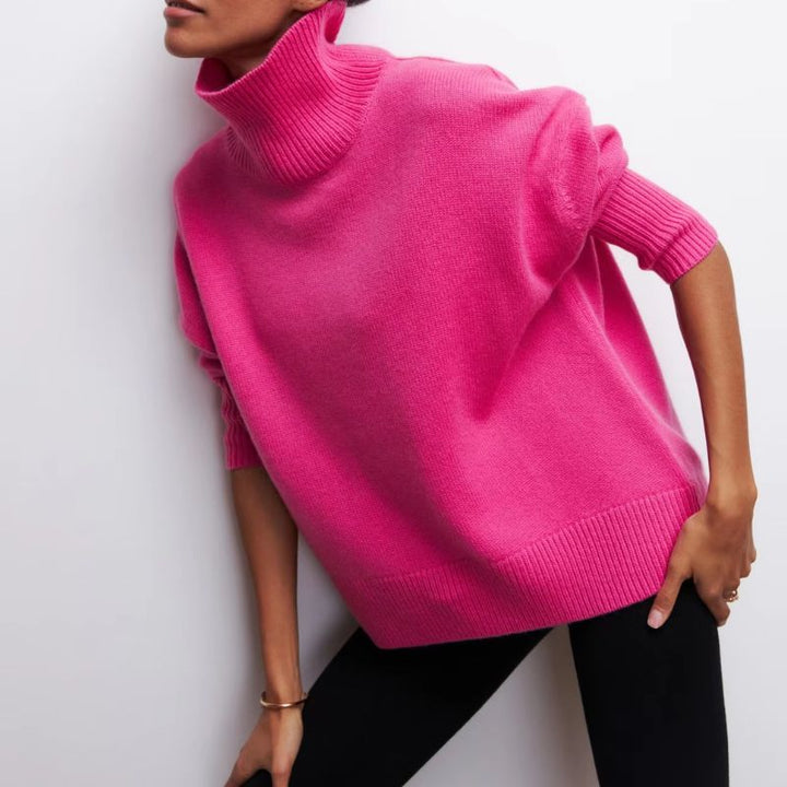 Women's cozy oversized knit turtleneck sweater, perfect for winter and fall comfort.