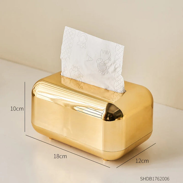 Modern minimalist gold & silver tissue dispenser, a luxury home decor bathroom accessory.