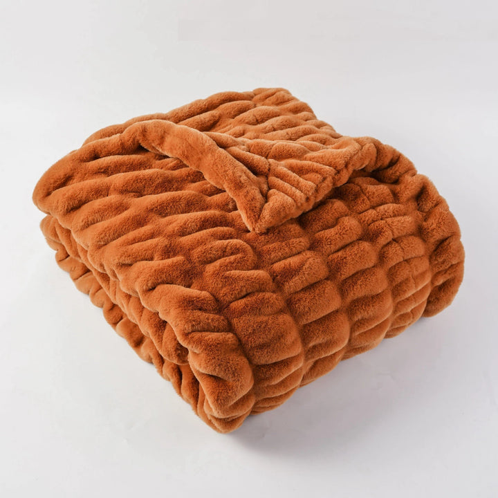 Premium plush faux fur throw blanket, exceptionally soft and warm for ultimate relaxation.