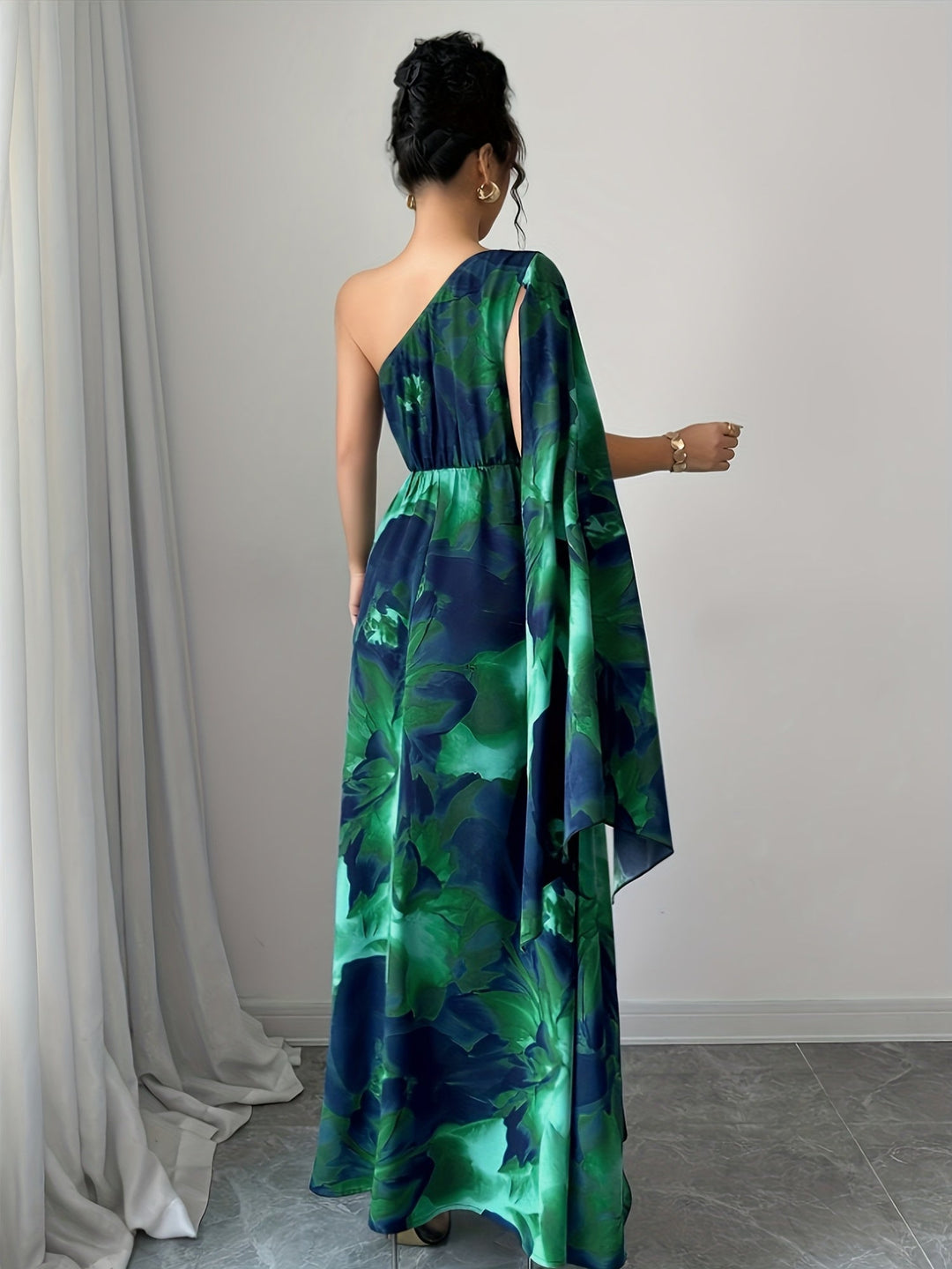 Sophisticated women's one-shoulder floral maxi dress. Perfect for wedding guests and special occasion events.