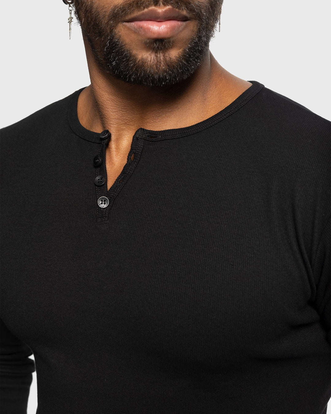 Fashionable men's long sleeve henley, ribbed design ensures comfort & modern style.