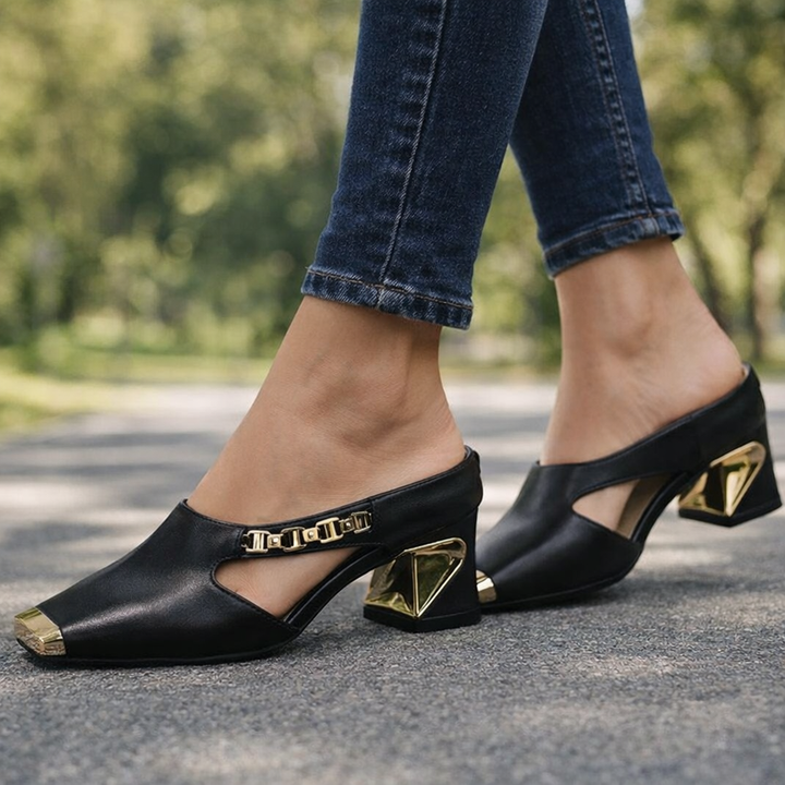 Stylish women's fashion heels featuring a sleek pointed toe and luxurious gold metal cap.