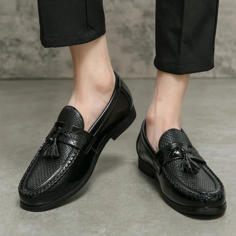 Classic men's brown tassel loafers with comfortable woven design. Ideal slip-on dress shoes for formal or casual wear.