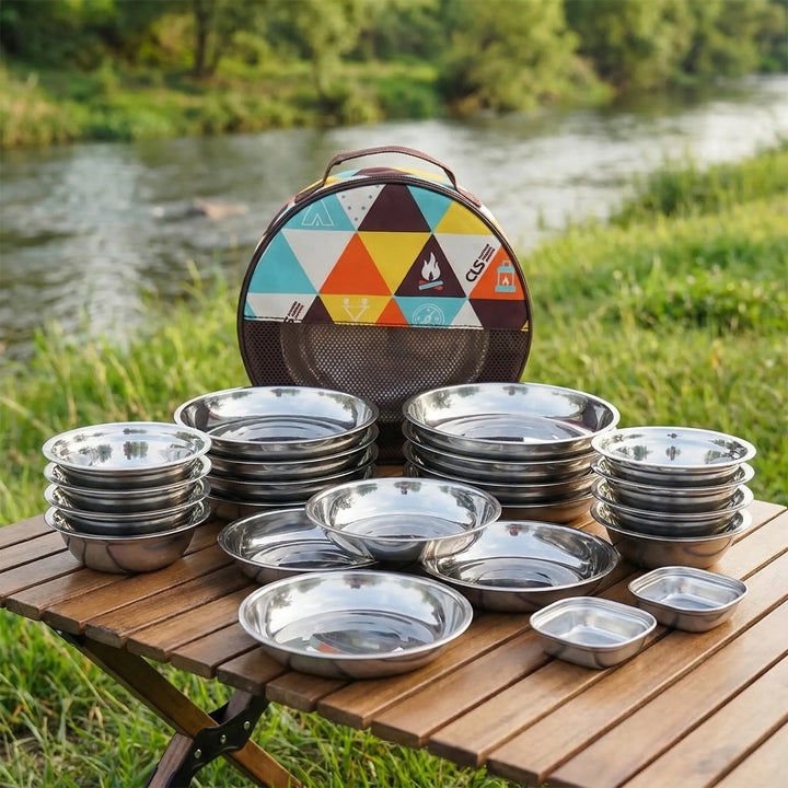 22-piece outdoor family tableware set for camping and picnics, featuring durable metal plates, bowls, and cutlery.