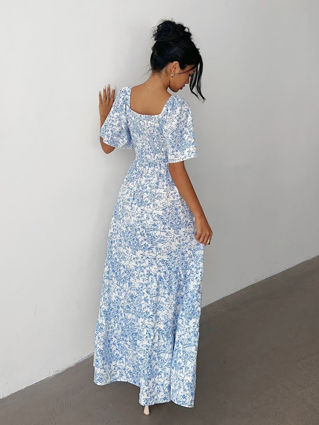 Sweetheart tiered maxi dress for women, featuring a vibrant floral pattern, great for summer parties.