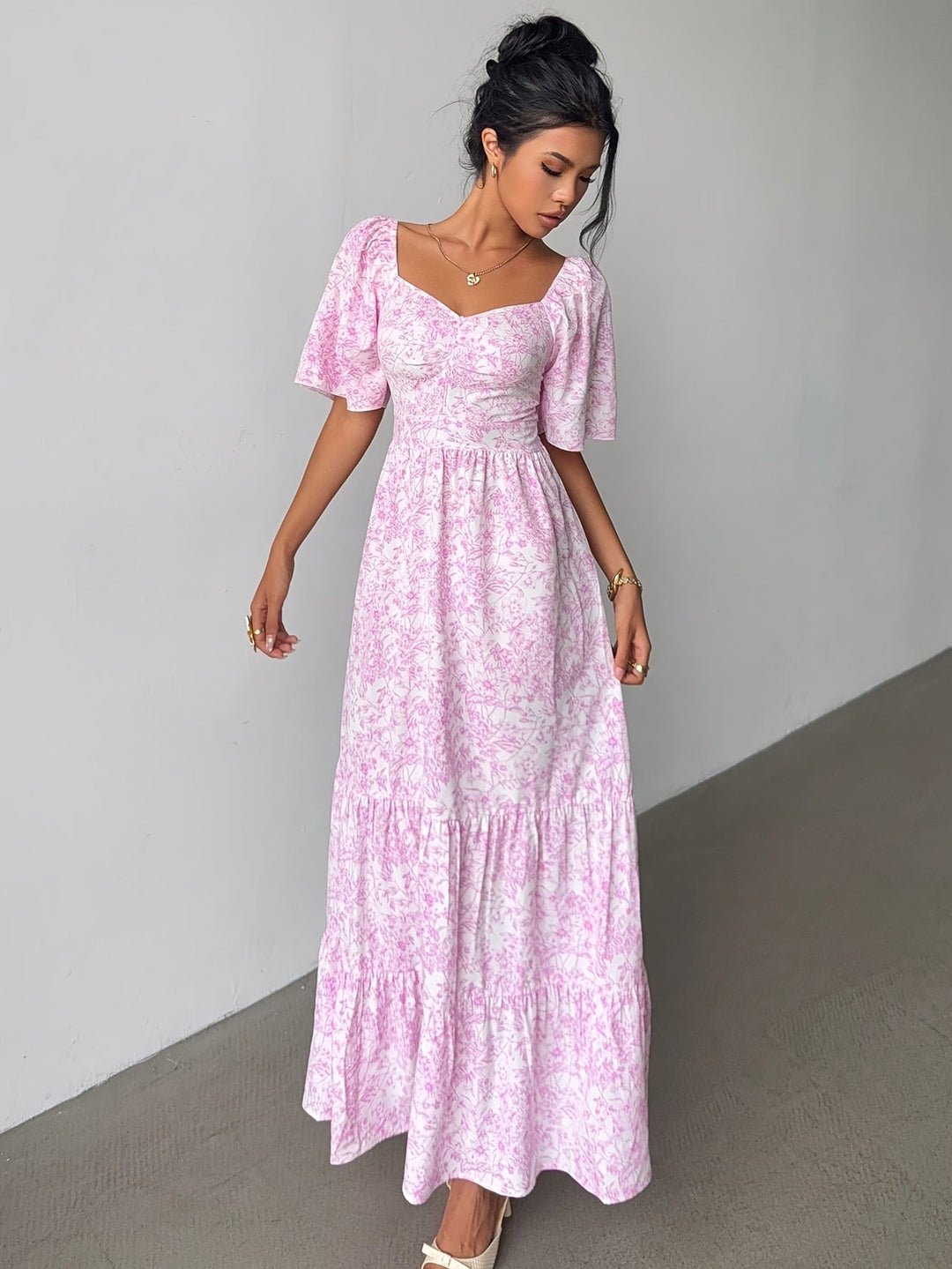 Women's floral tiered maxi dress with sweetheart neckline, perfect for summer fashion & elegant casual wear.