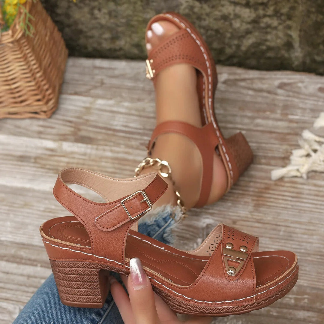 Stylish open-toe block heel platform sandals for women. Cushioned cross-straps for everyday comfort.