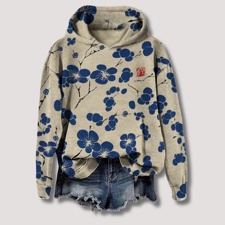 Lightweight women's floral print hooded sweater for ultimate summer comfort. Relaxed fit, trendy spring & summer top.