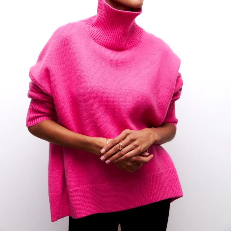 Warm, comfortable women's oversized knit turtleneck sweater for fall and winter fashion.