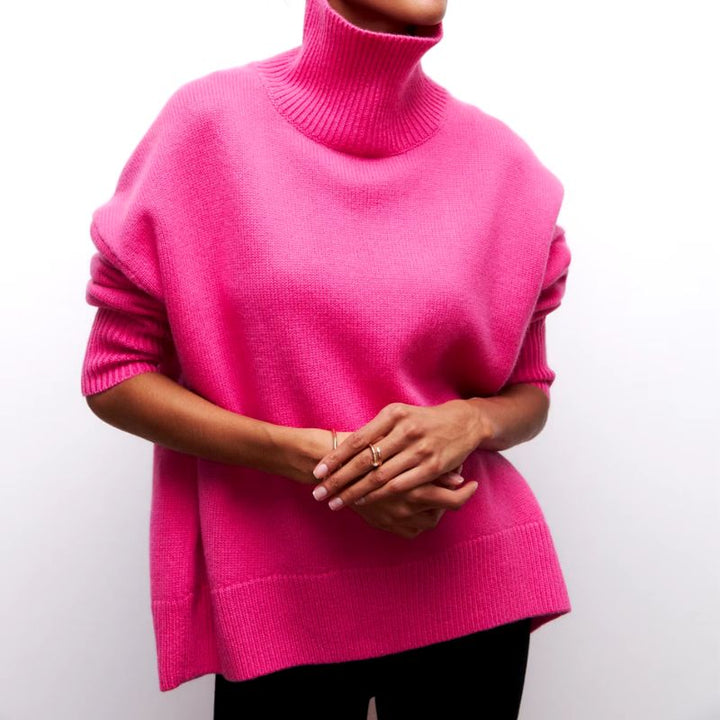 Warm, comfortable women's oversized knit turtleneck sweater for fall and winter fashion.