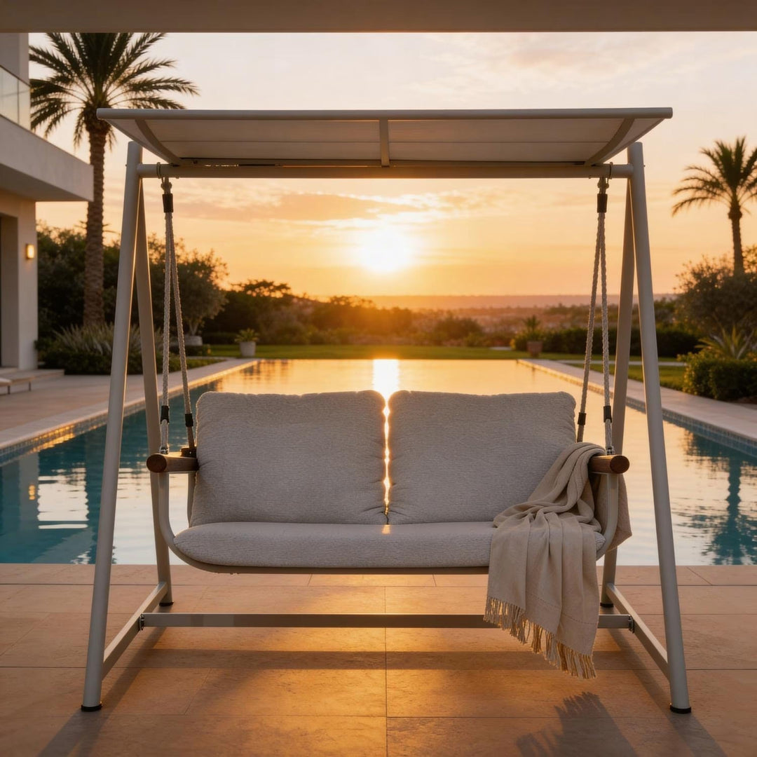 Relaxing cream 2-seater outdoor swing chair, perfect for your patio or garden lounge, featuring a durable aluminum frame.