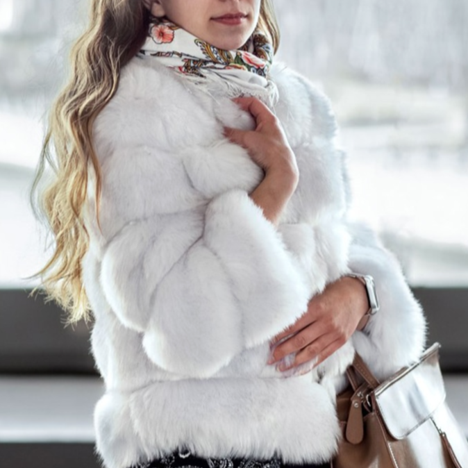Elegant women's short plush coat, designed for a chic winter look and ultimate cozy warmth.