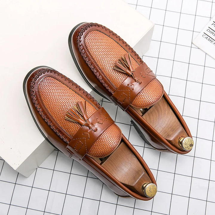 Textured men's woven tassel loafers in a rich brown hue. Versatile slip-on shoes, ideal for a smart casual or formal look.
