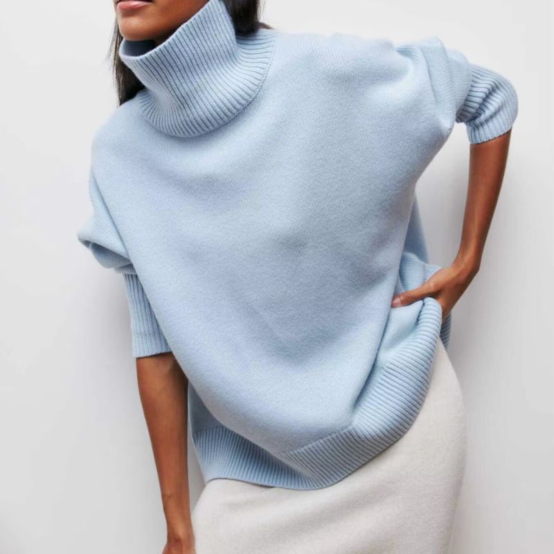 Stylish women's oversized knit turtleneck sweater. Cozy casual wear, ideal for cold weather.
