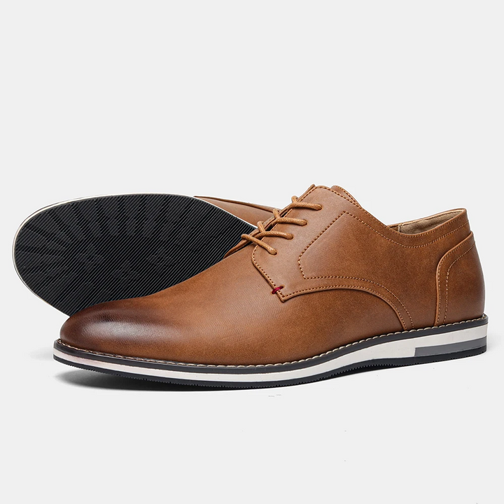 Pair of classic men's Derby dress shoes, ready for professional style, business, and formal events.