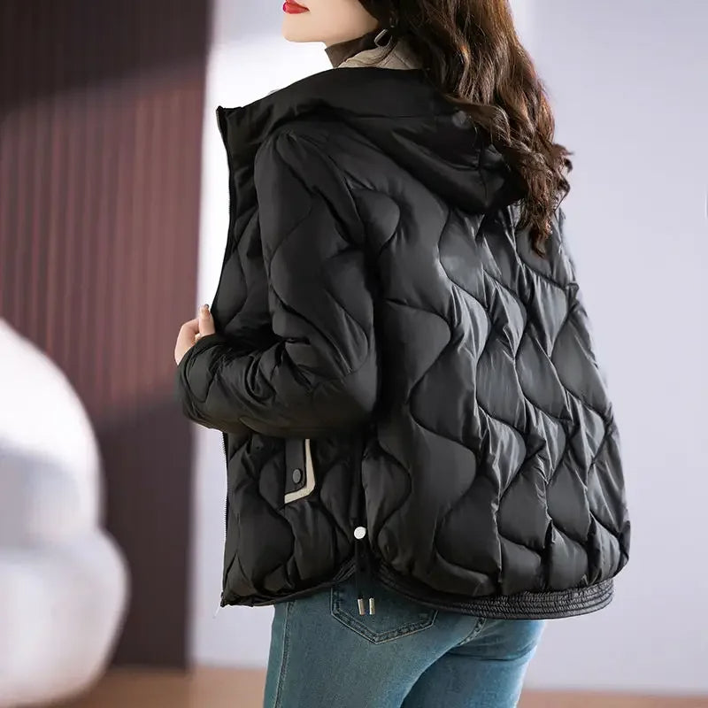 Full view of a woman in a stylish quilted puffer jacket, ready for fall & winter fashion.