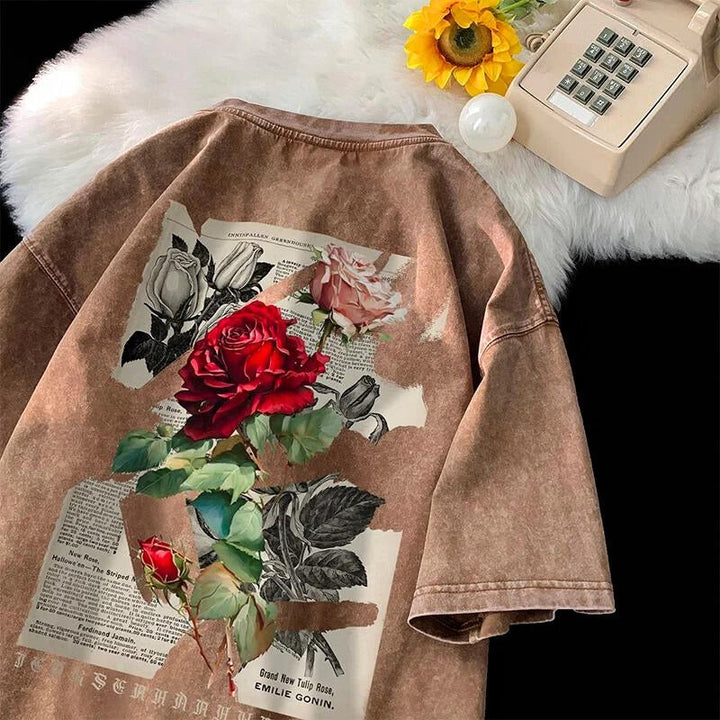 Oversized unisex t-shirt featuring a washed rose graphic, great for a relaxed, casual look.