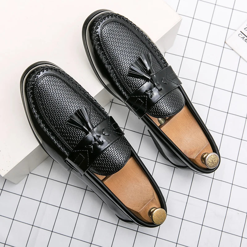 Detailed close-up of men's leather woven tassel loafers. Exquisite craftsmanship for a stylish and elegant fashion statement.