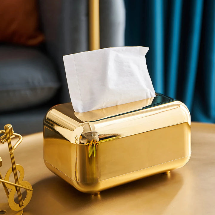 Refined gold & silver tissue dispenser, bringing modern elegance to any room.