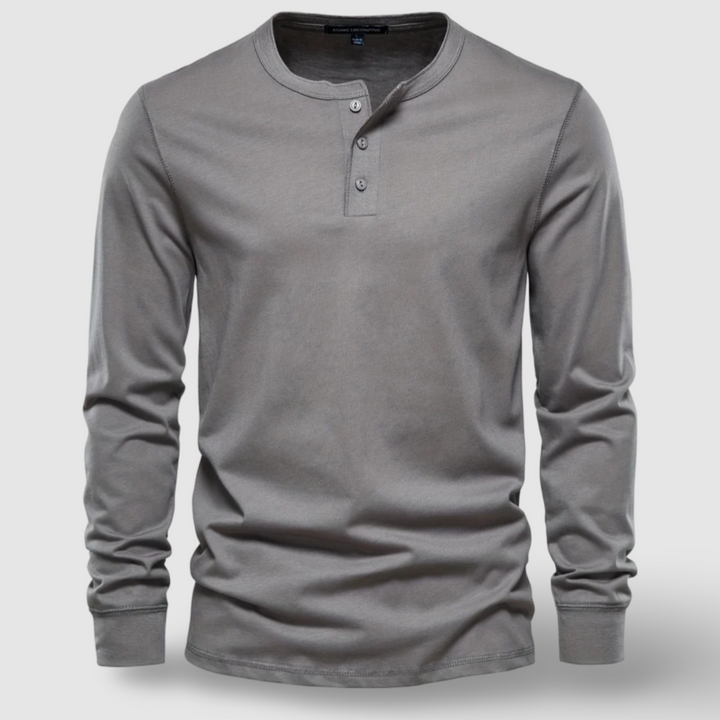 Classic men's solid long sleeve henley, great for layering or standalone casual looks.