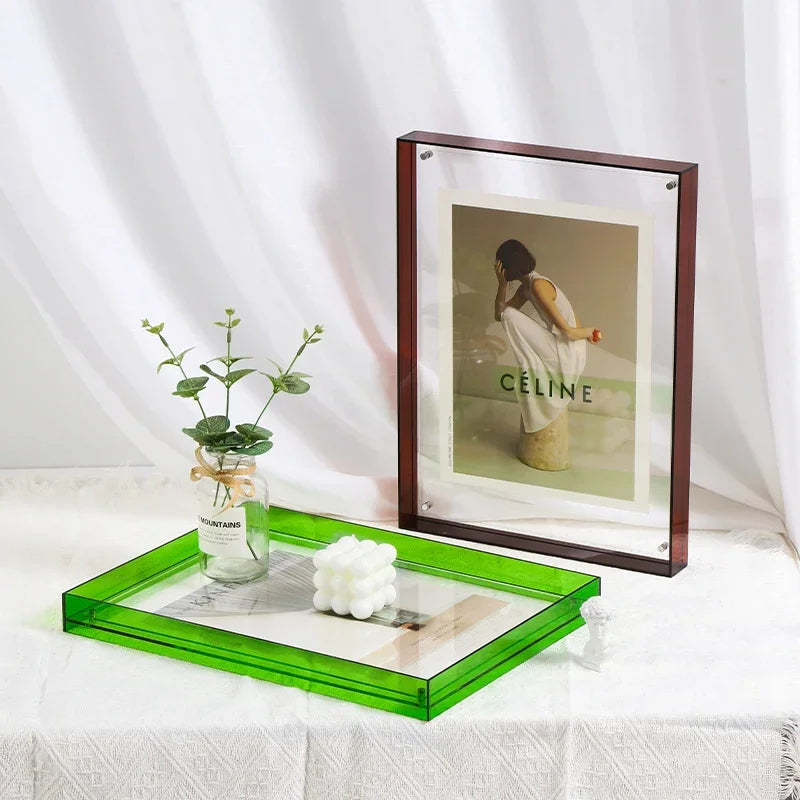 Clear acrylic picture frame, contemporary design for wall or desk art display.