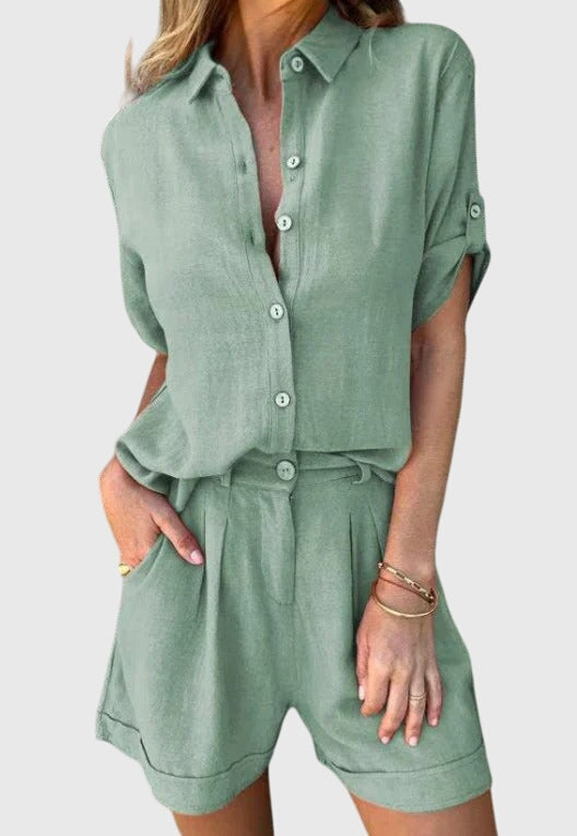 Model wearing a women's two piece shorts set, featuring a short sleeve top & comfortable shorts.