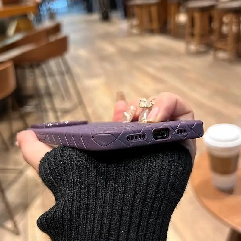 Close-up of a stylish woven texture phone case, providing durable phone protection.