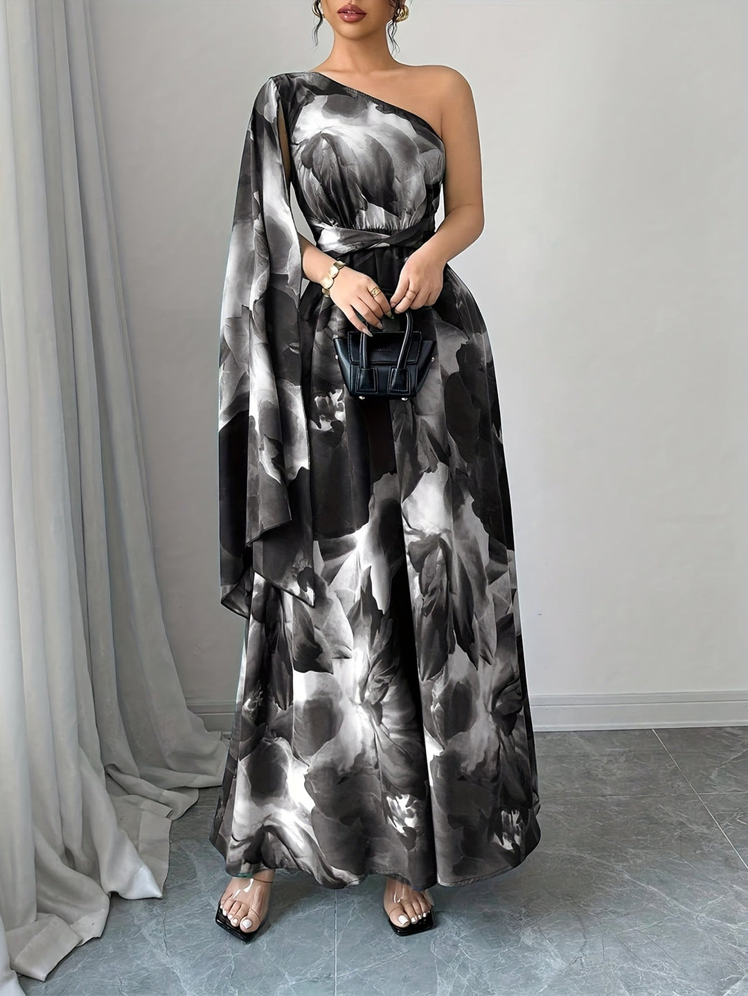 One-shoulder women's maxi dress with elegant detailing. Ideal formal dress for wedding guests & special events.