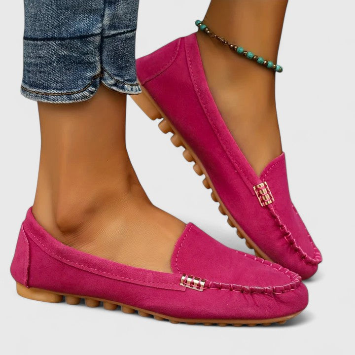 Modern women's orthopedic slip-on loafers, combining ease of wear with eye-catching metal embellishments.