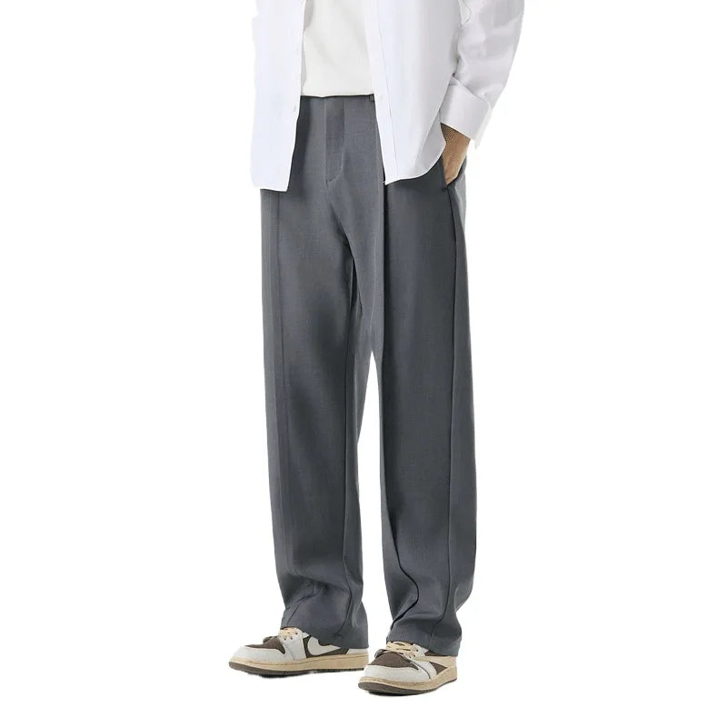 Stylish men's fashion with pleated drape trousers, combining comfort & a relaxed, modern fit.