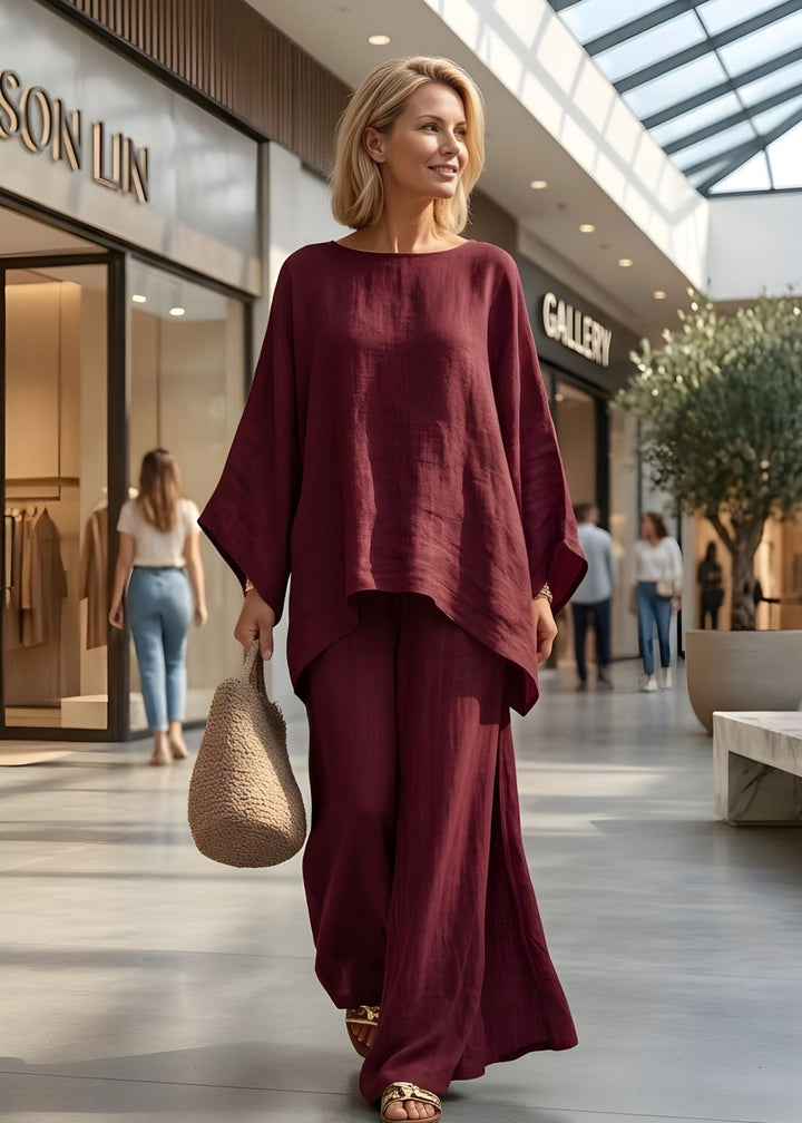 Stylish women's cape style top, part of a two-piece set, offering a flowy & elegant look for spring.