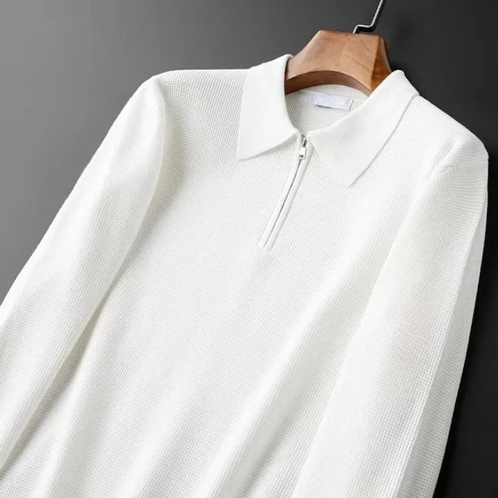 Relaxed fit unisex pullover sweater featuring a practical zip collar. Versatile and comfortable for everyday styling.