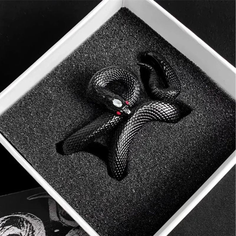 Close-up of black serpent-style earbud case. Unique, protective, and durable wireless accessory.