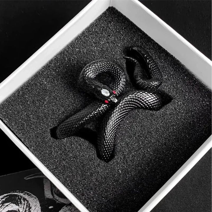 Close-up of black serpent-style earbud case. Unique, protective, and durable wireless accessory.