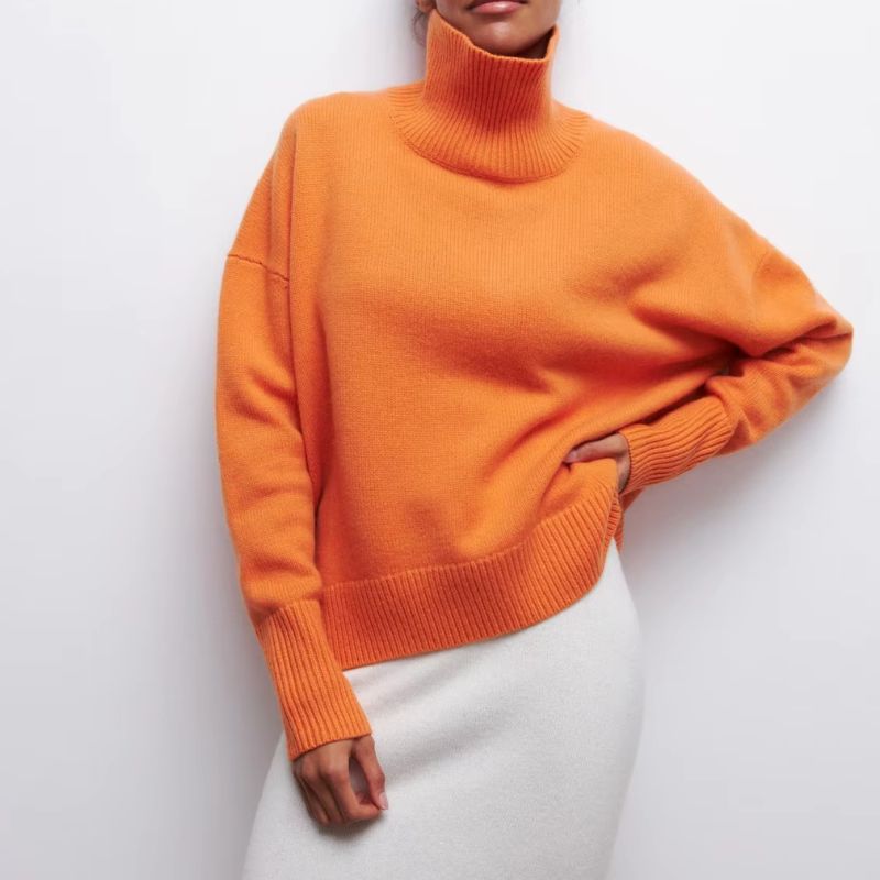 Women's oversized knit turtleneck sweater. Cozy casual wear for relaxed fall & winter days.