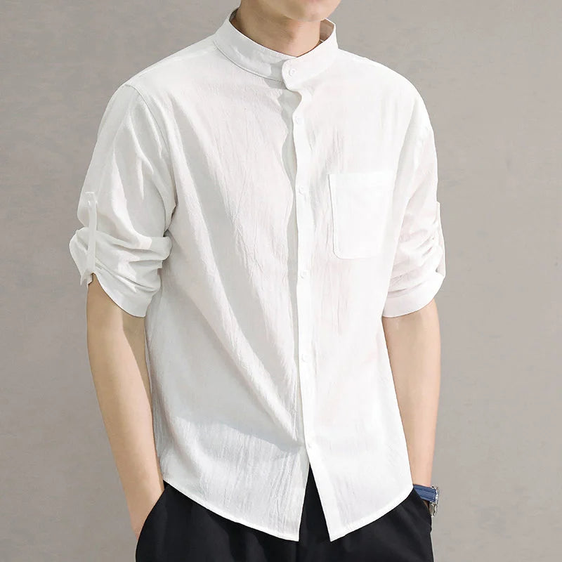 Classic men's long-sleeve cotton button-up shirt, designed for breathable everyday comfort.