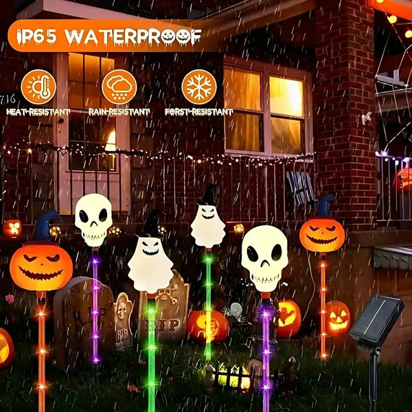 Lawn decorated with 6-pack solar LED Halloween pumpkin and ghost lights, perfect holiday decor